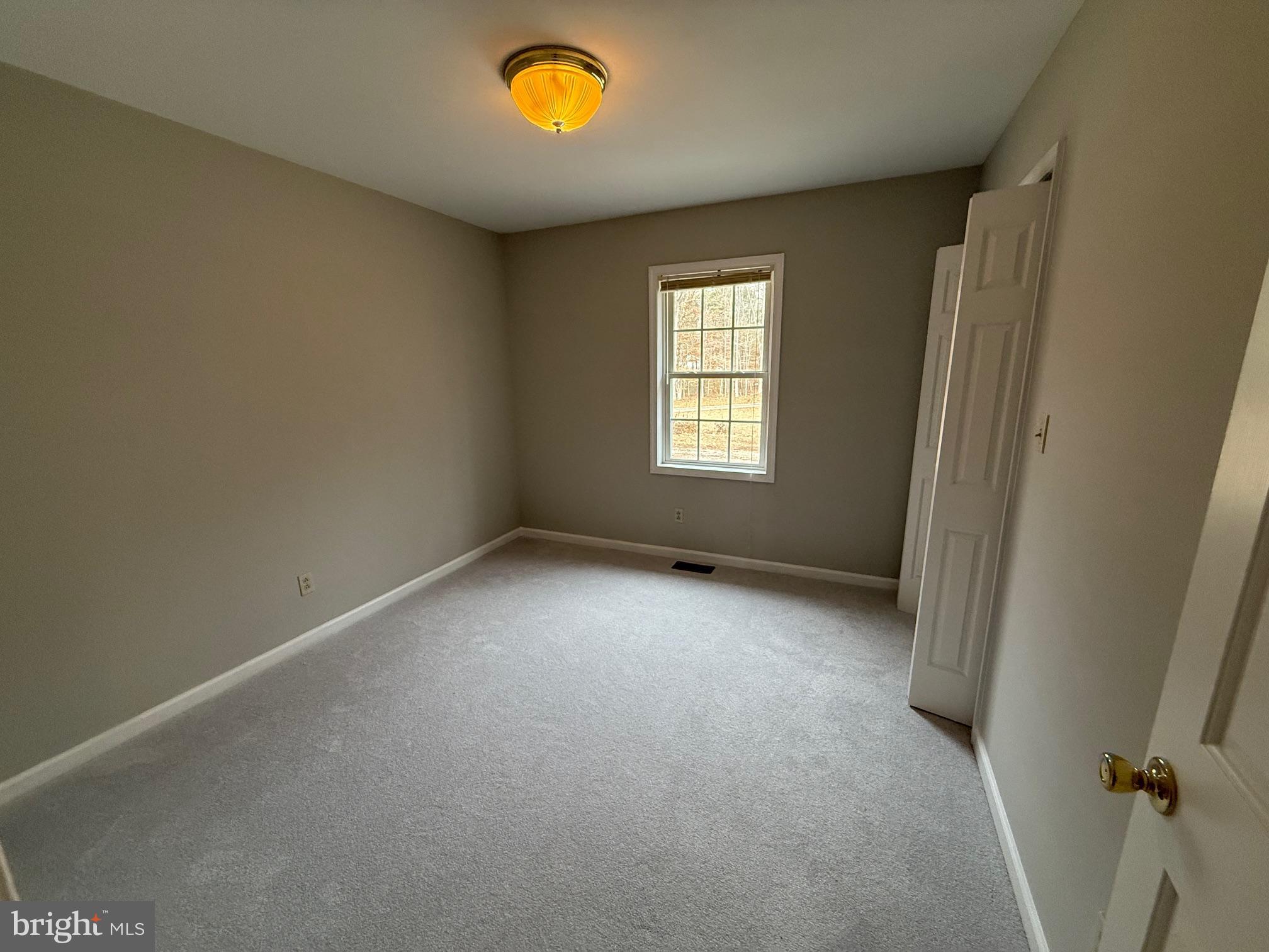 5545 Yanceyville Road Louisa, VA 23093 - Photo 26 of 64 an empty room with a window