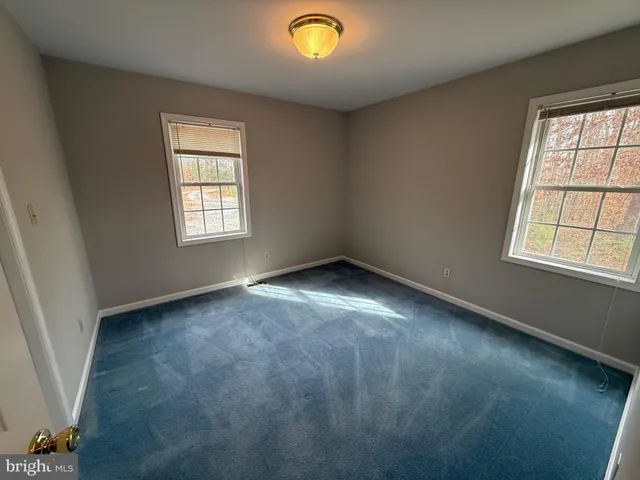 a view of gallery with wooden floor