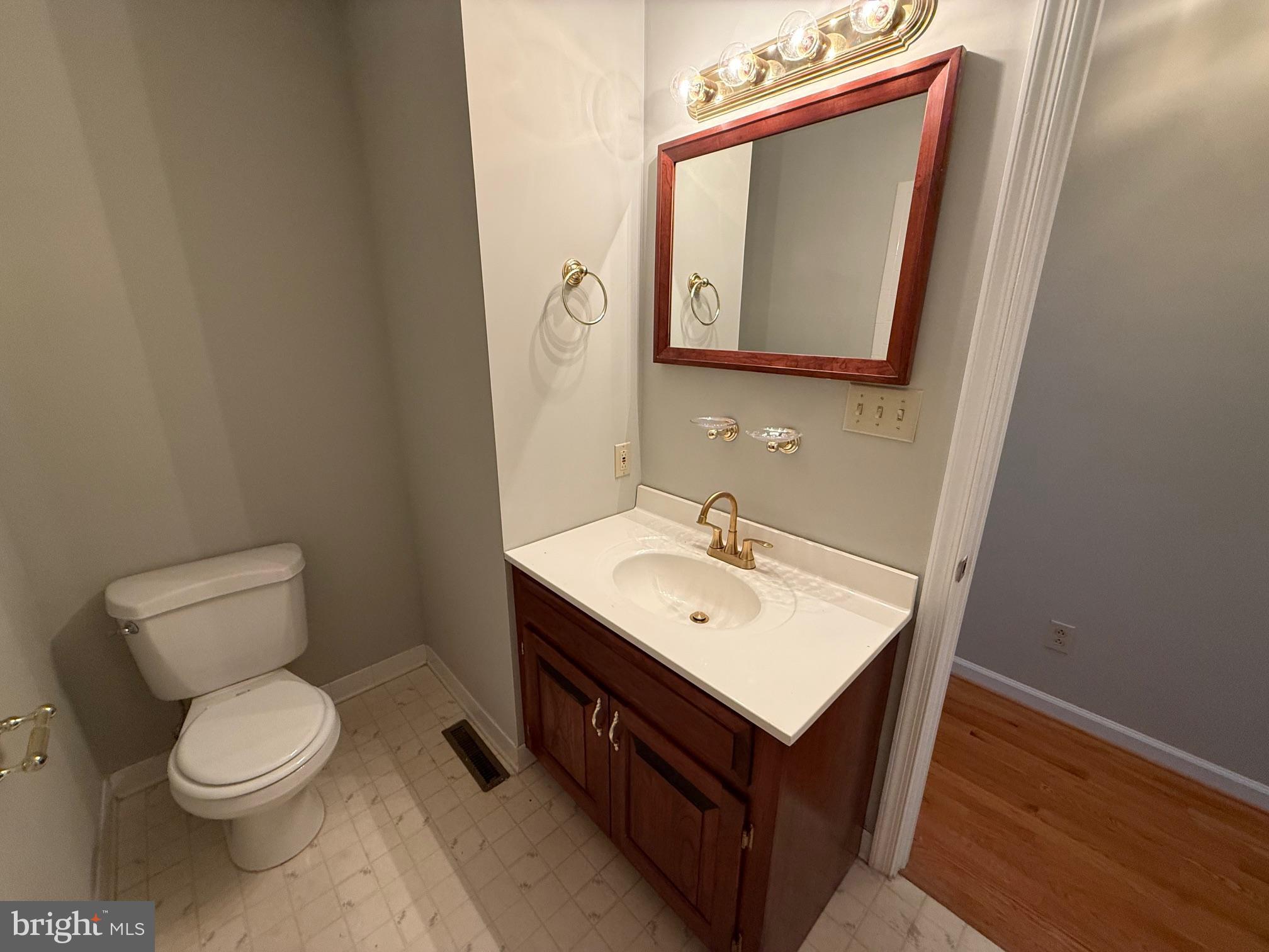 5545 Yanceyville Road Louisa, VA 23093 - Photo 30 of 64 a bathroom with a toilet sink and mirror