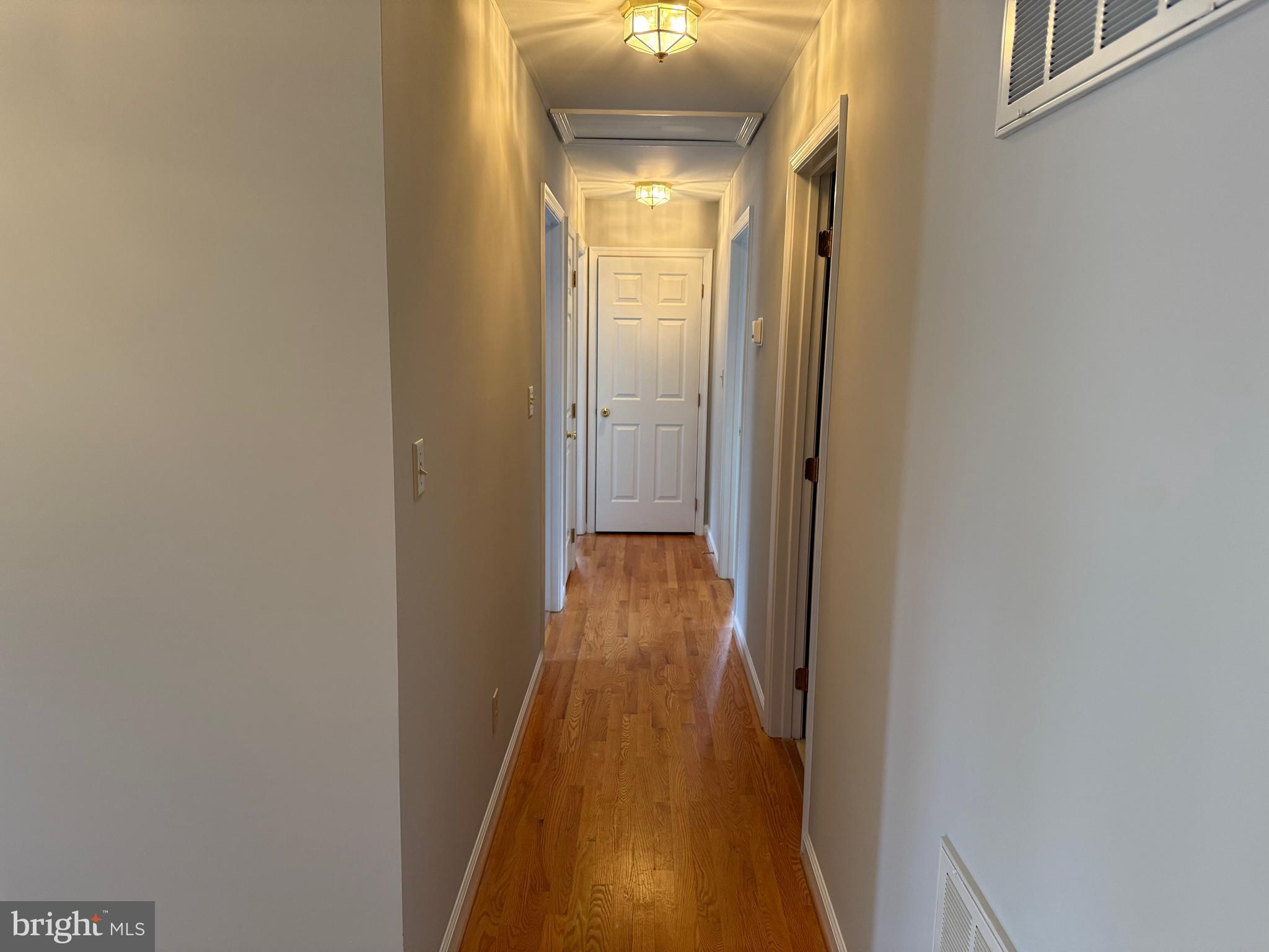 5545 Yanceyville Road Louisa, VA 23093 - Photo 30 of 63 a view of a hallway with wooden floor