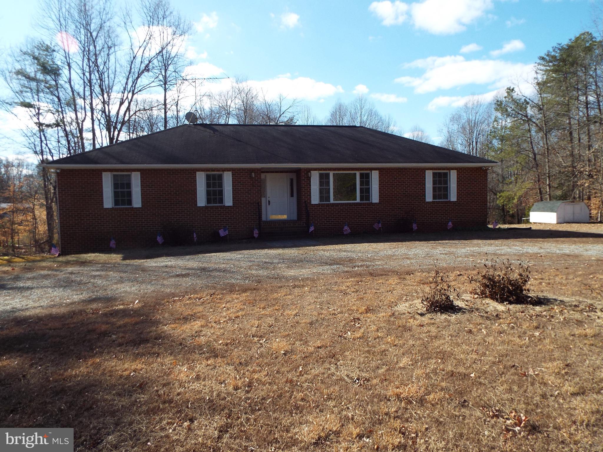 5545 Yanceyville Road Louisa, VA 23093 - Photo 3 of 64 a front view of a house with a yard