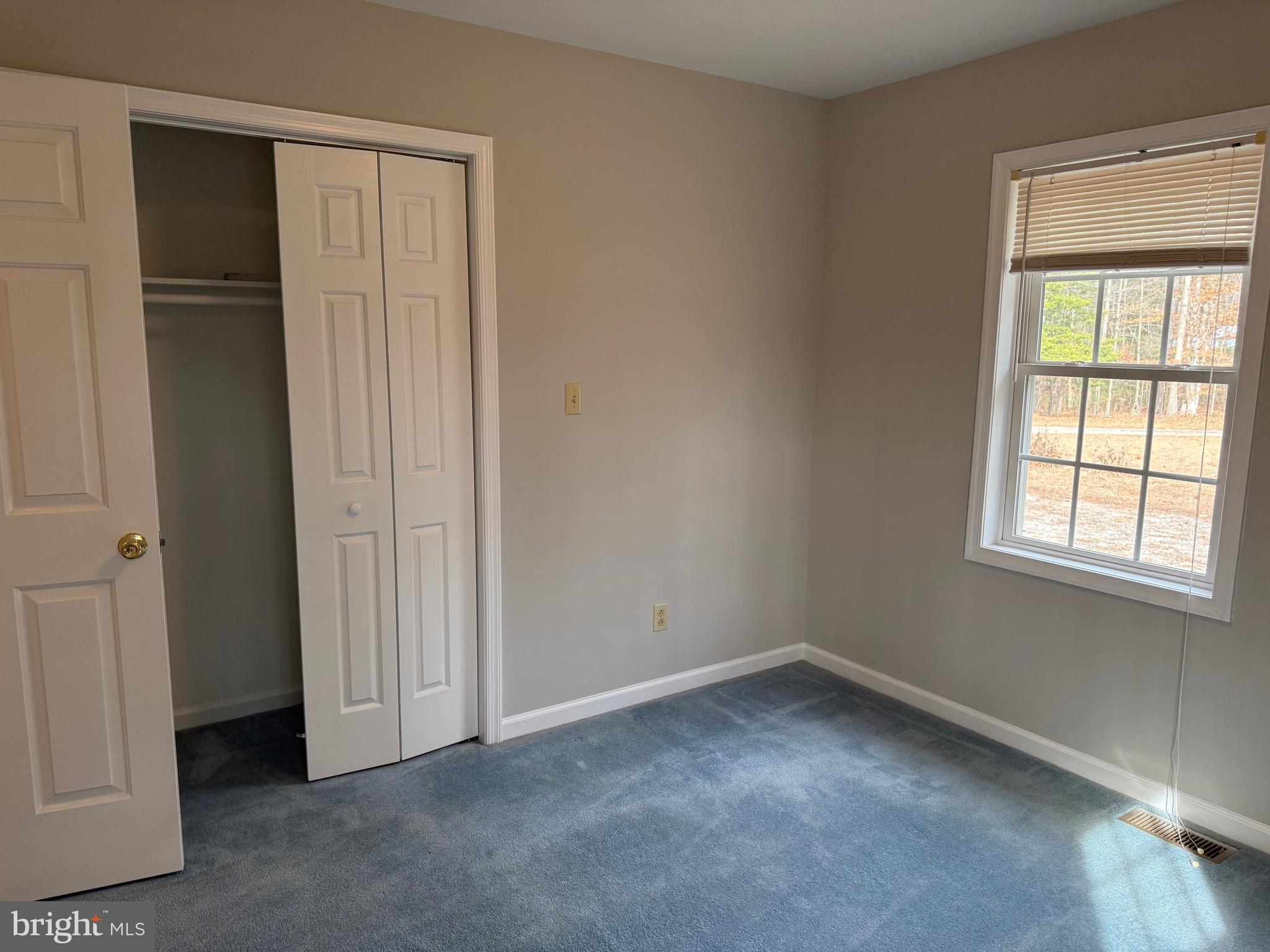 5545 Yanceyville Road Louisa, VA 23093 - Photo 41 of 63 an empty room with a window