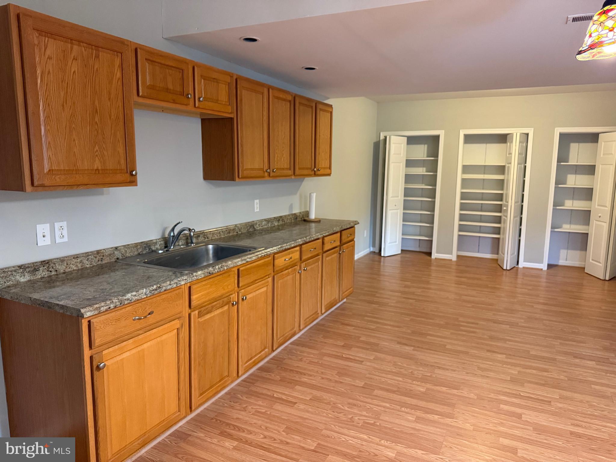5545 Yanceyville Road Louisa, VA 23093 - Photo 45 of 63 a kitchen with stainless steel appliances granite countertop a sink stove and cabinets