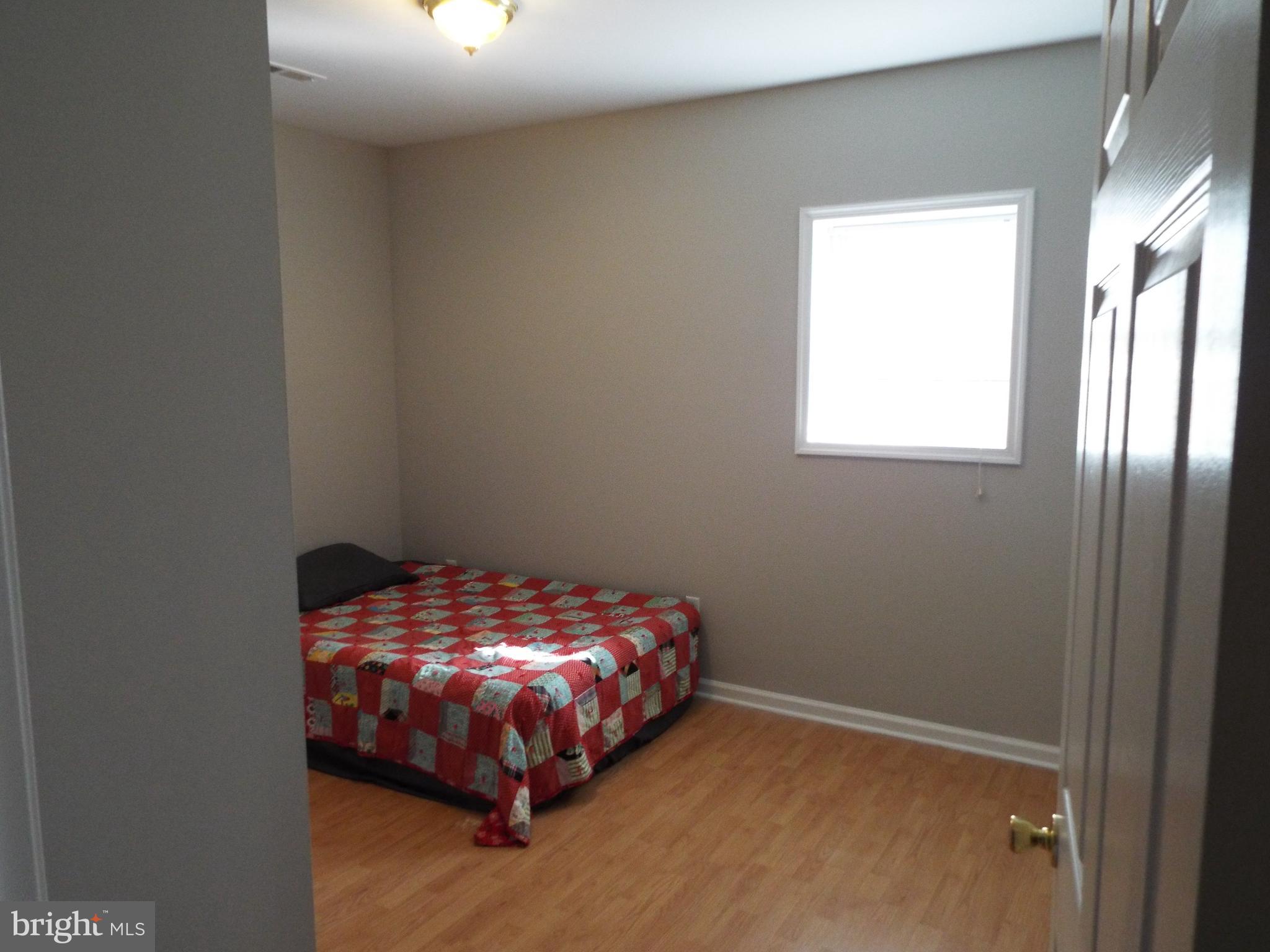 5545 Yanceyville Road Louisa, VA 23093 - Photo 61 of 64 a room with a bed and a window