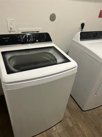 a close view of stove a microwave and door