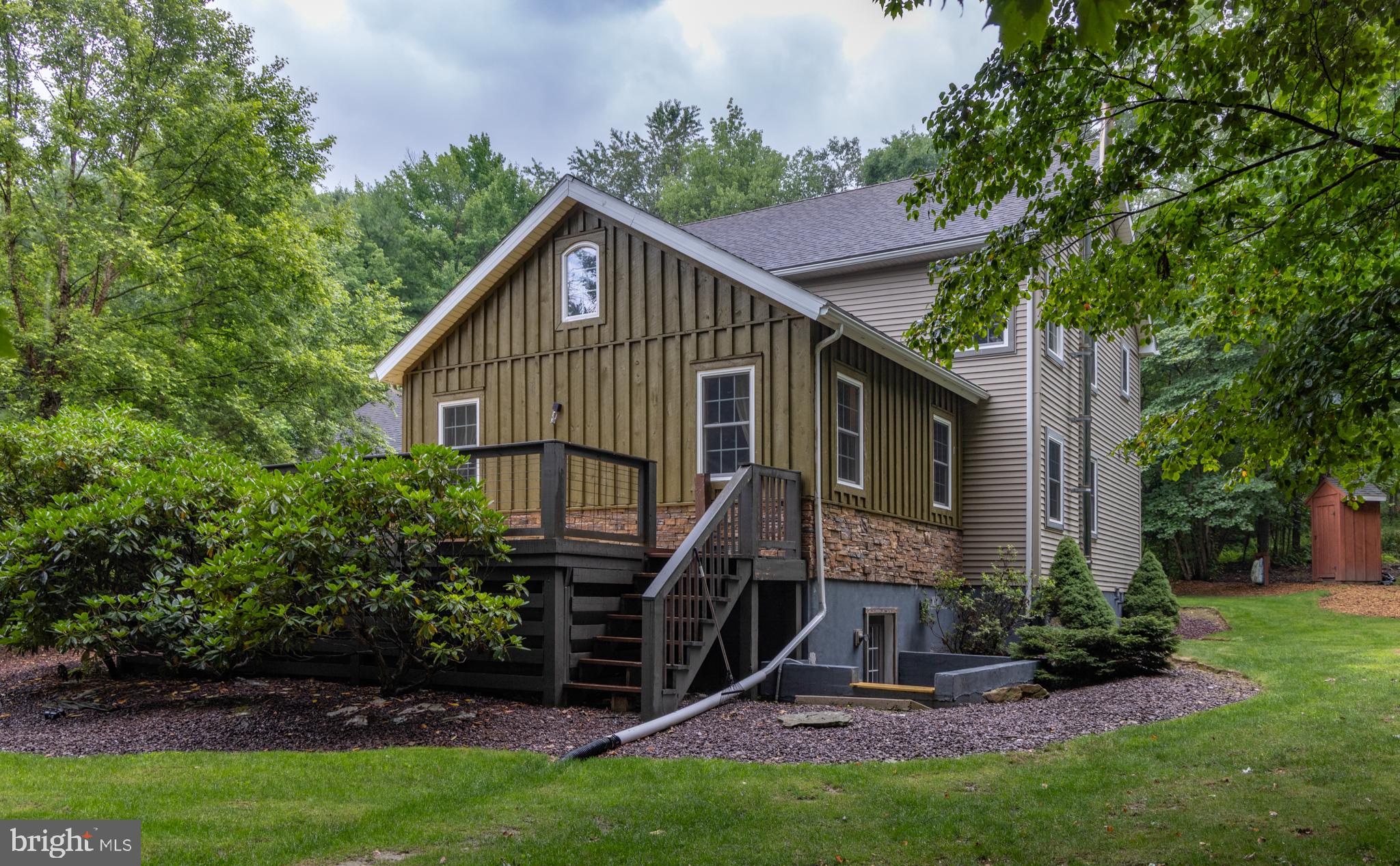 348 Decker Valley Road Spring Mills, PA 16875 - Photo 19 of 28 Charming home nestled in lush greenery.