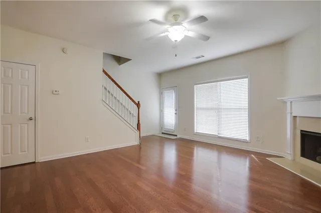 a view of a house with wooden fence