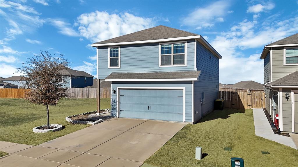 233 Lewis Lane Venus, TX 76084 - Photo 2 of 40 Angled front exterior view emphasizing the home’s spacious lot, huge side yard, and attractive two-story elevation.