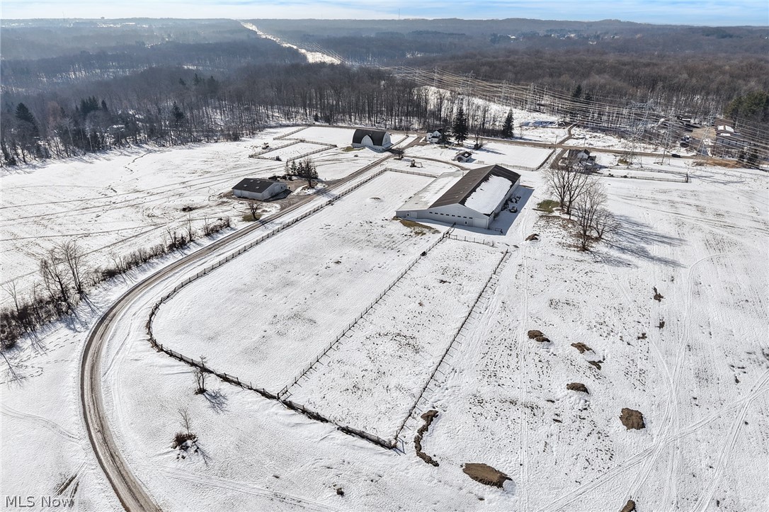 9455 Robinson Road Chardon, OH 44024 - Photo 26 of 33 Snowy aerial view with a view of trees