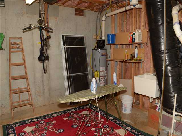 5412 Earle Road Raleigh, NC 27606 - Photo 25 of 25 One View of Unfinished area in Basement. HVAC and Water Heater located here. Also a 3rd Car Garage!
