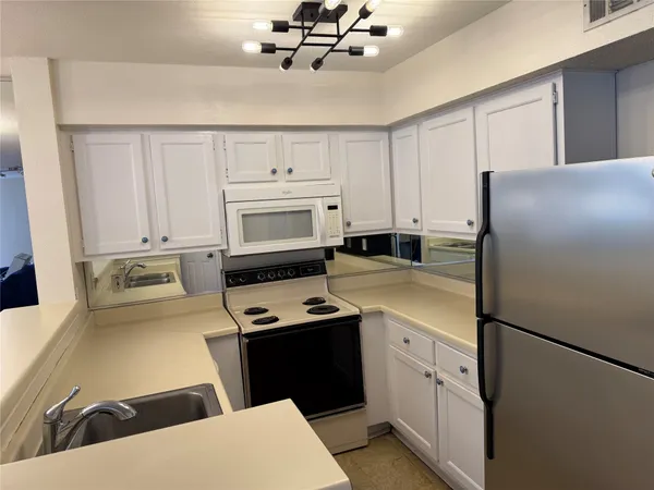 a close up view of washer and dryer with washer