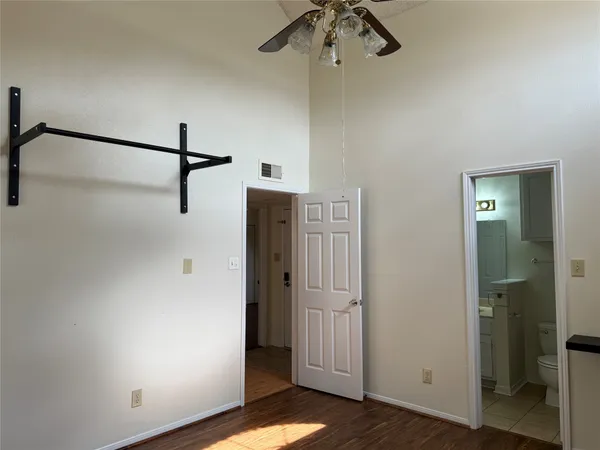 a view of a white house with a yard