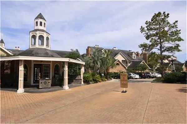 a view of a house with swimming pool and a small yard