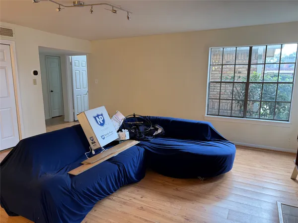 a room with a bed and a window