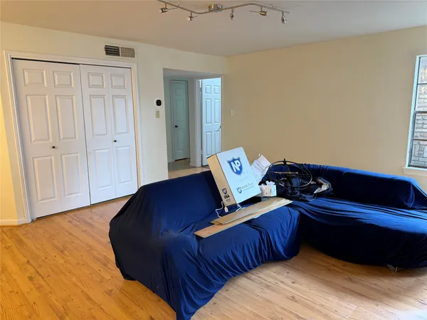 a bed room with a bed and a window