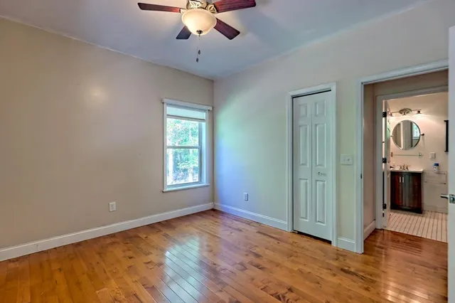 a view of outdoor space with wooden floor and windows