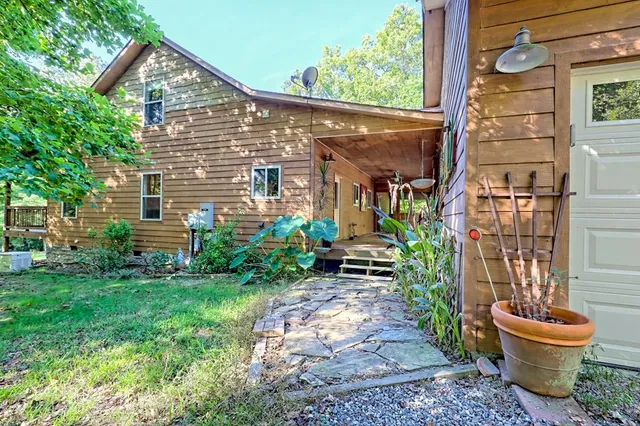 a large kitchen with stainless steel appliances a refrigerator and a stove top oven