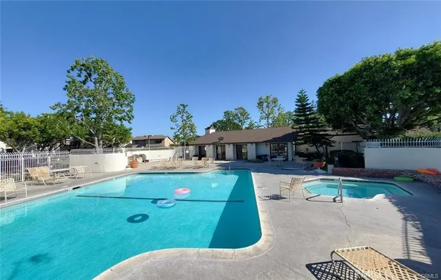 a view of swimming pool with seating space