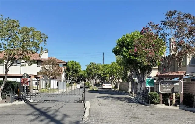 a view of a street with houses on both side