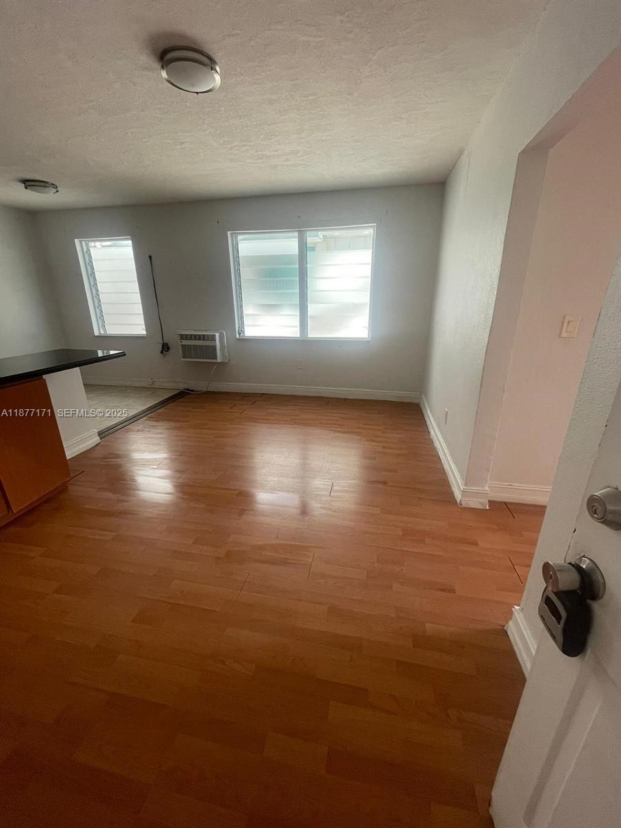 7928 Harding Avenue, Unit 1 Miami Beach, FL 33141 - Photo 12 of 17 a view of a livingroom with a window