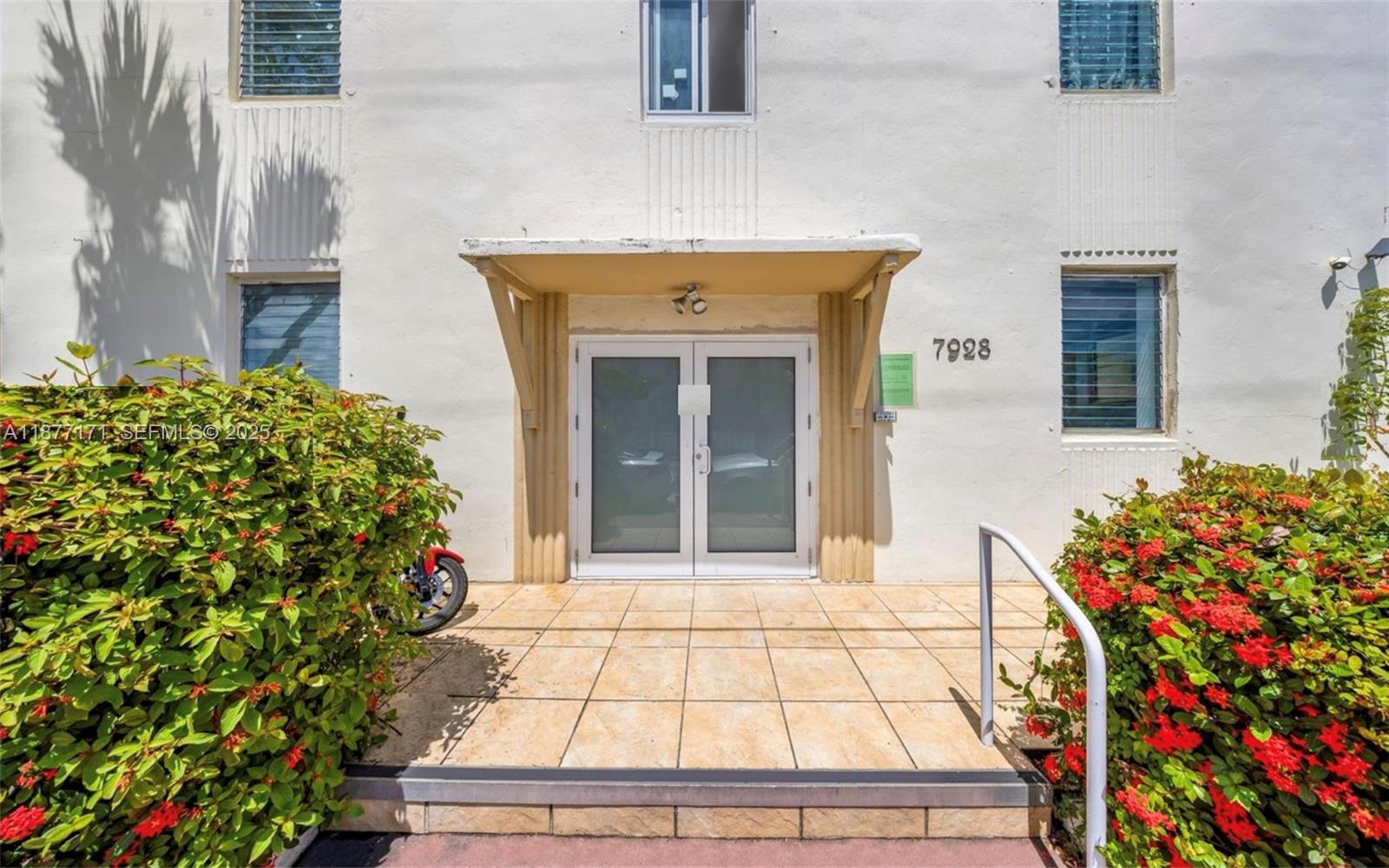 7928 Harding Avenue, Unit 1 Miami Beach, FL 33141 - Photo 2 of 17 front view of a house with a potted plant