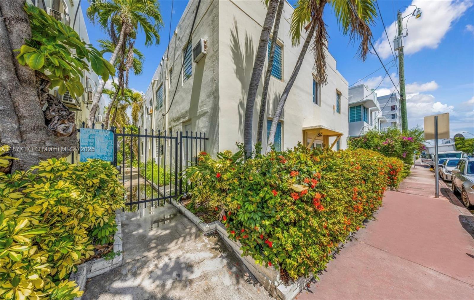 7928 Harding Avenue, Unit 1 Miami Beach, FL 33141 - Photo 3 of 17 a view of a garden with pathway