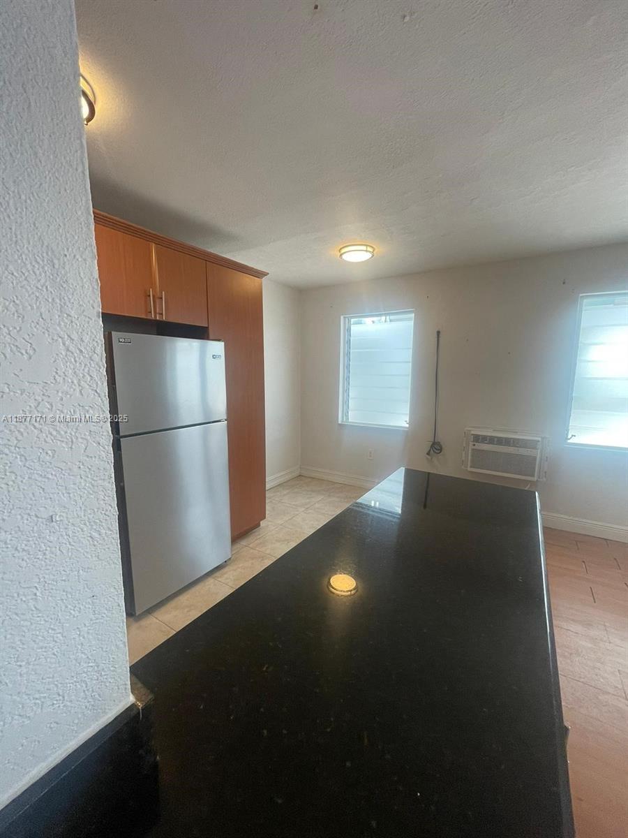 7928 Harding Avenue, Unit 1 Miami Beach, FL 33141 - Photo 10 of 17 a view of empty room with front door