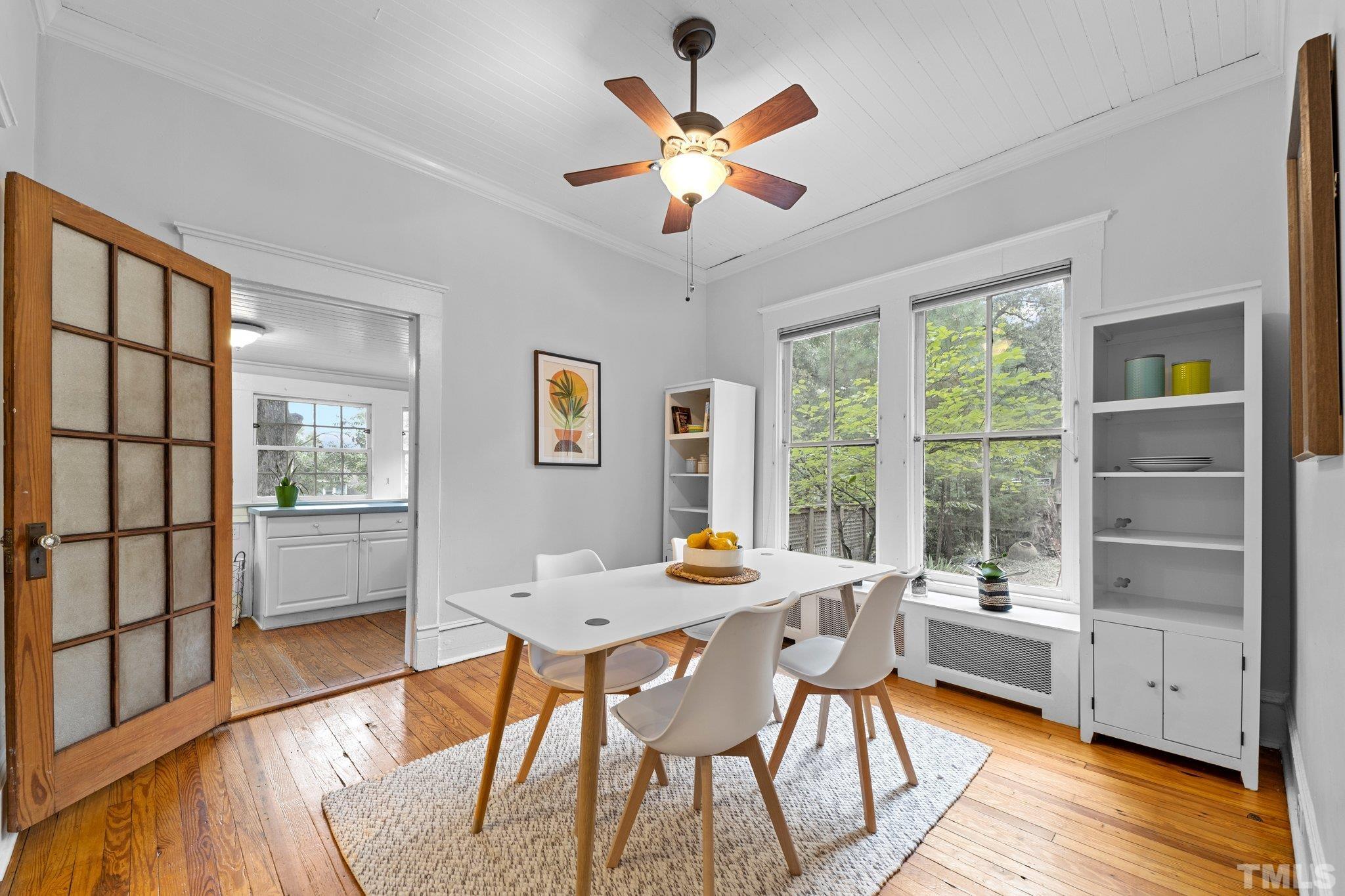 801 Onslow Street Durham, NC 27705 - Photo 14 of 30 a workspace with wooden floor and a large window