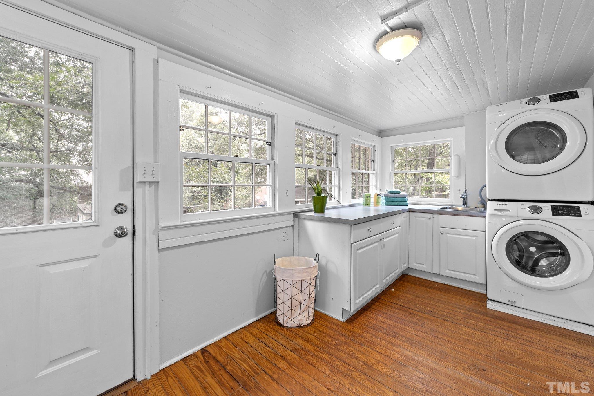 801 Onslow Street Durham, NC 27705 - Photo 15 of 30 a view of a kitchen with wooden floor and floors