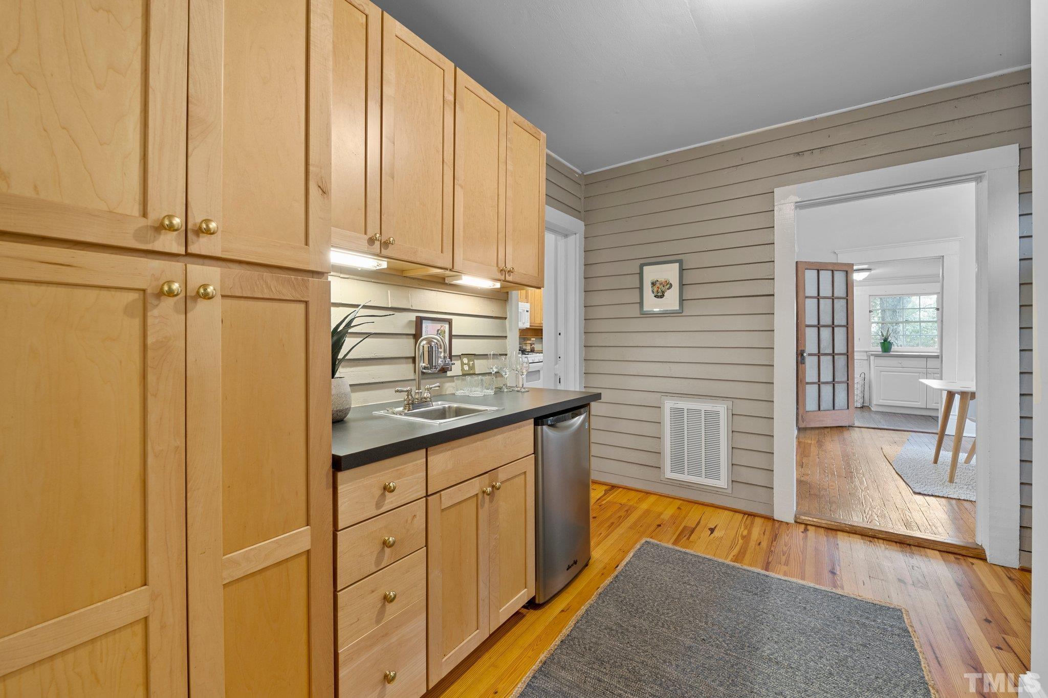 801 Onslow Street Durham, NC 27705 - Photo 16 of 30 a kitchen with stainless steel appliances granite countertop a sink and cabinets