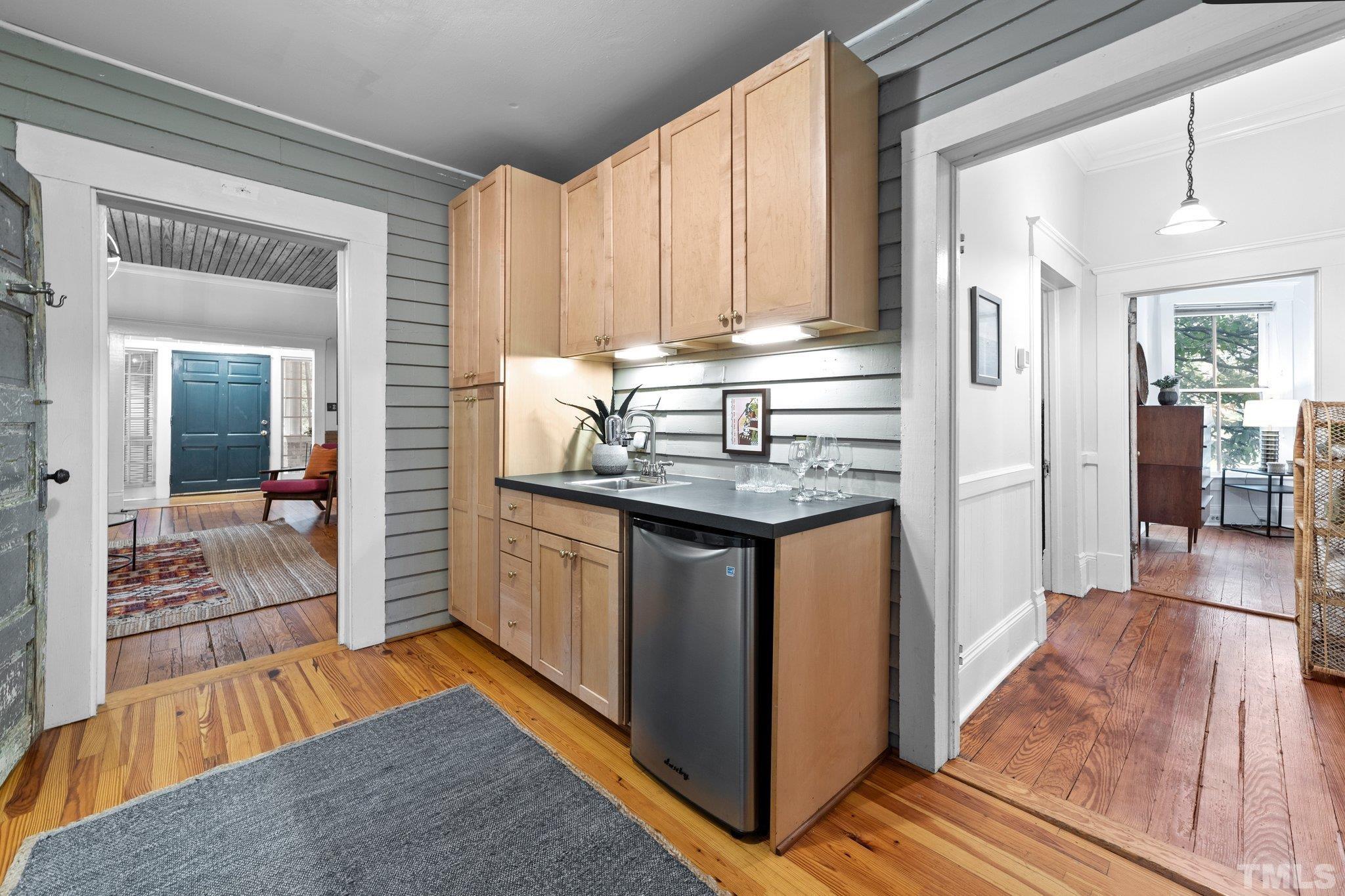 801 Onslow Street Durham, NC 27705 - Photo 17 of 30 a kitchen with stainless steel appliances granite countertop a refrigerator and a sink