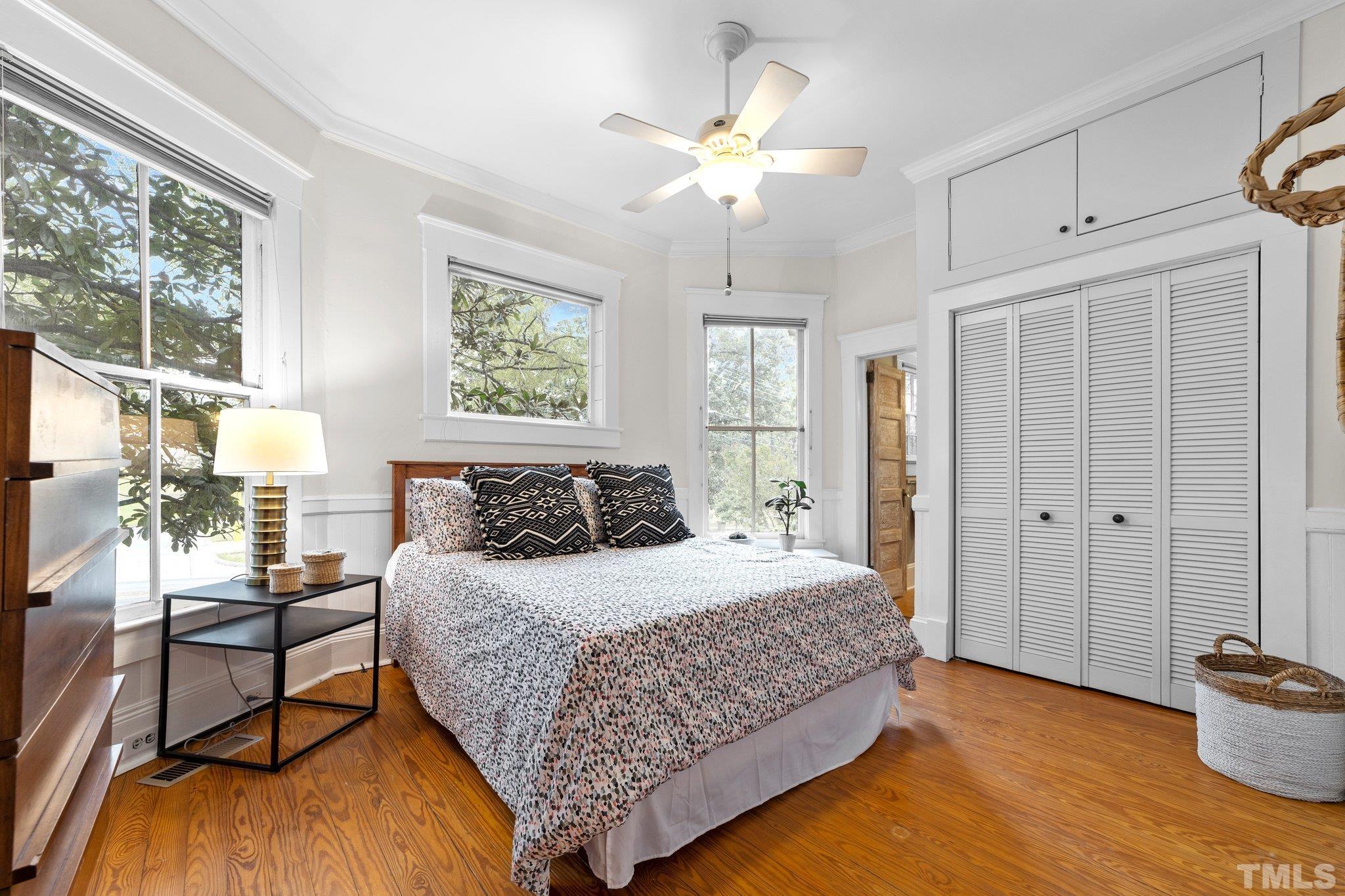 801 Onslow Street Durham, NC 27705 - Photo 18 of 30 a bedroom with a bed and a table in it