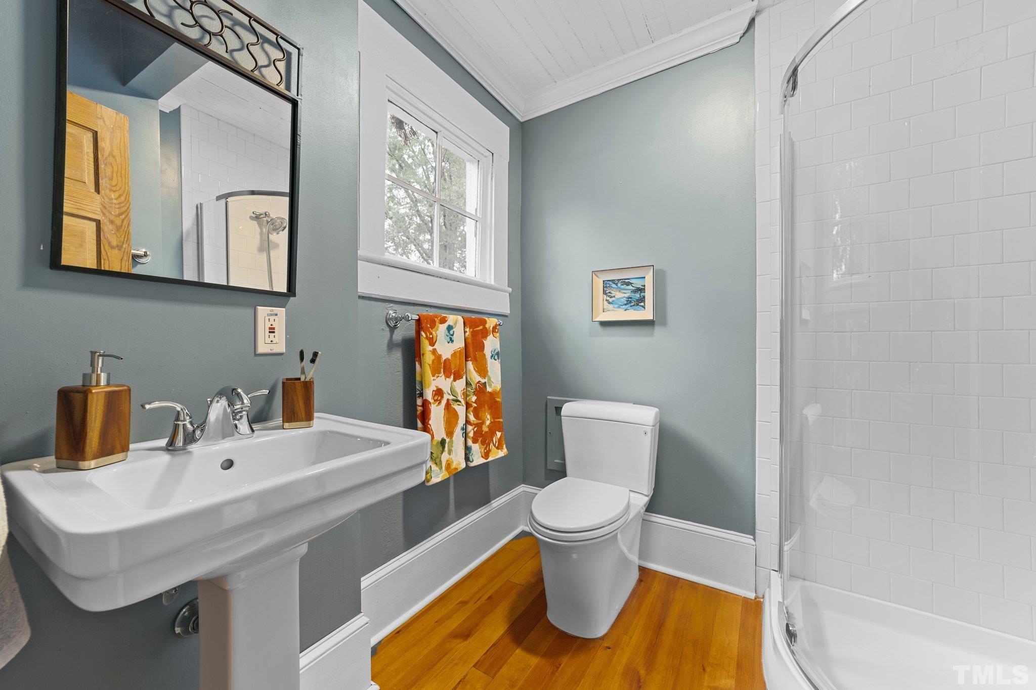 801 Onslow Street Durham, NC 27705 - Photo 22 of 30 a bathroom with a sink toilet and mirror