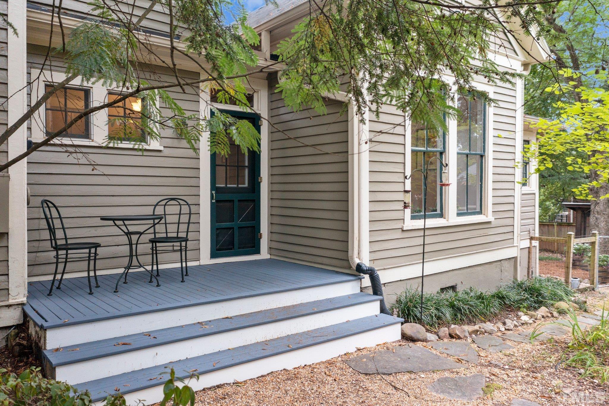 801 Onslow Street Durham, NC 27705 - Photo 25 of 30 a view of a chair and tables in the back yard of the house