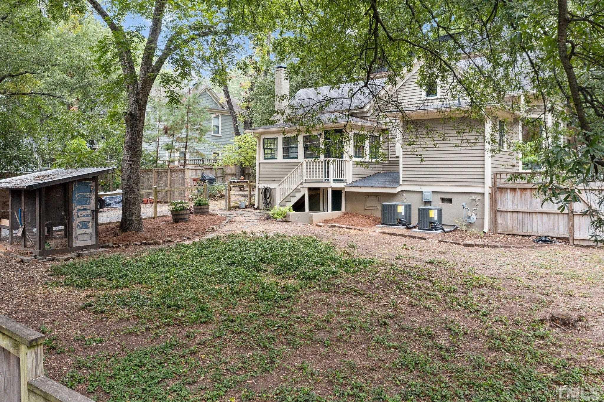 801 Onslow Street Durham, NC 27705 - Photo 26 of 30 a view of a house with backyard and a tree