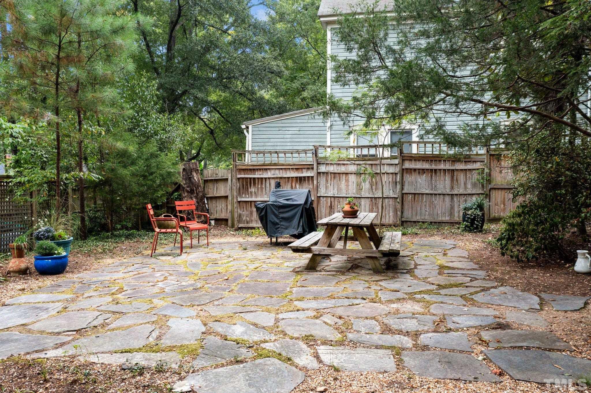 801 Onslow Street Durham, NC 27705 - Photo 28 of 30 a view of backyard with a table and chairs