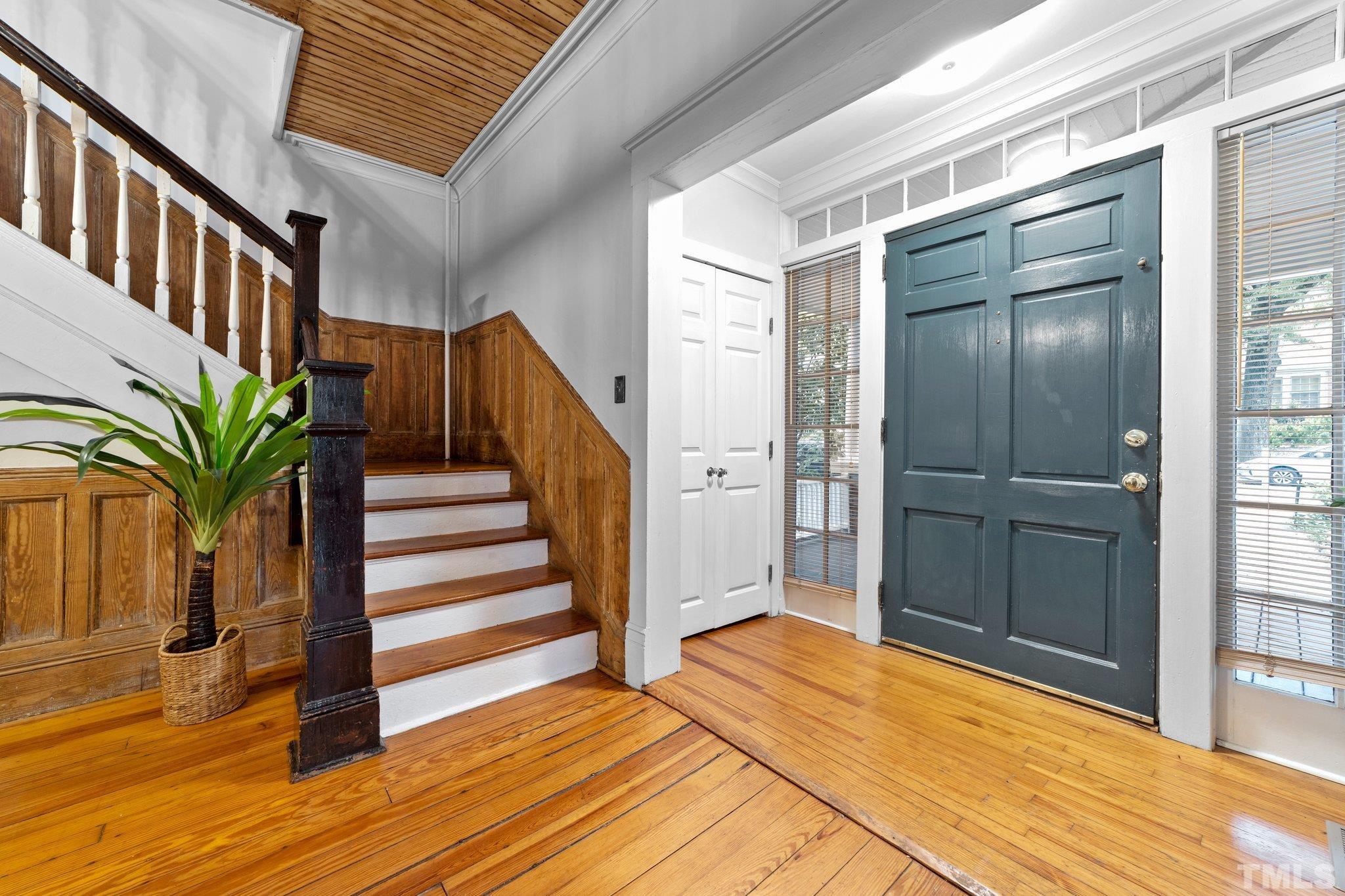 801 Onslow Street Durham, NC 27705 - Photo 7 of 30 a view of a hallway with wooden floor and staircase