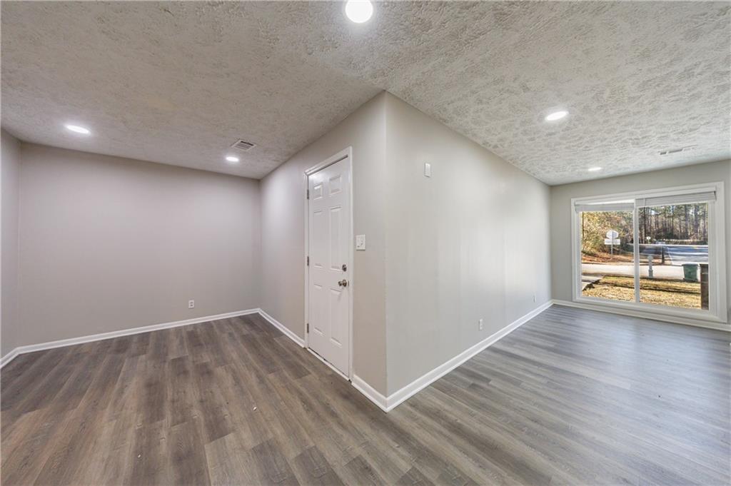 779 Amber Place Northwest Atlanta, GA 30331 - Photo 18 of 35 an empty room with wooden floor and windows