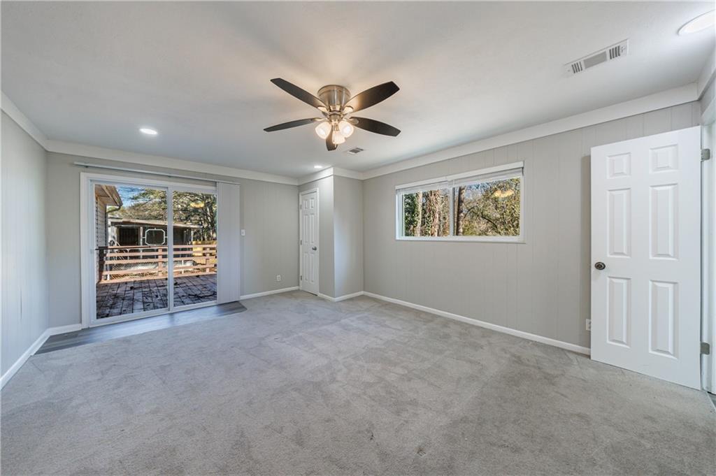 779 Amber Place Northwest Atlanta, GA 30331 - Photo 19 of 35 a view of a livingroom with a ceiling fan and window