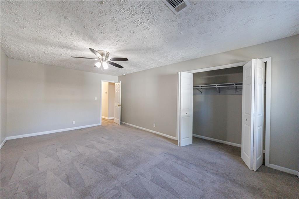 779 Amber Place Northwest Atlanta, GA 30331 - Photo 29 of 35 an empty room with closet and windows