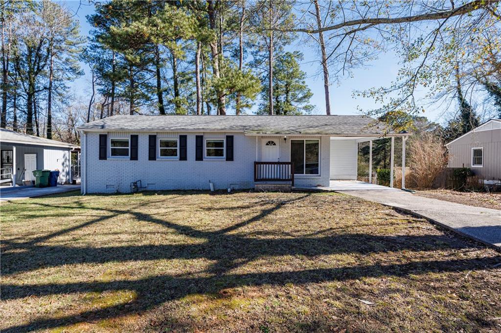 779 Amber Place Northwest Atlanta, GA 30331 - Photo 3 of 35 a front view of a house with a yard