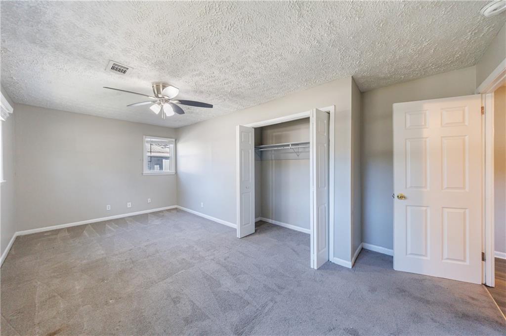 779 Amber Place Northwest Atlanta, GA 30331 - Photo 32 of 35 an empty room with fan and windows