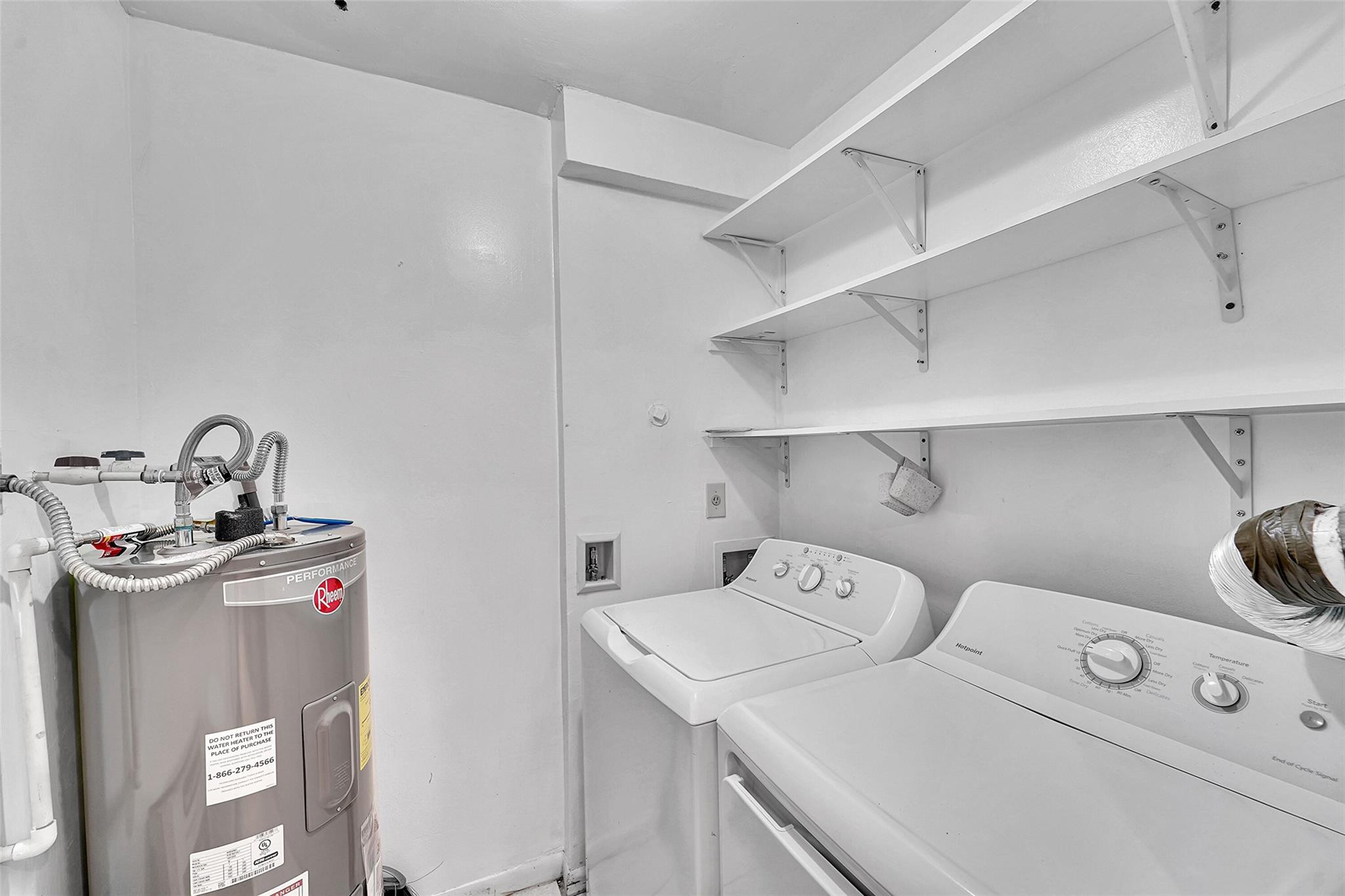 2698 North Nob Hill Road Sunrise, FL 33322 - Photo 8 of 27 a utility room with dryer and washer