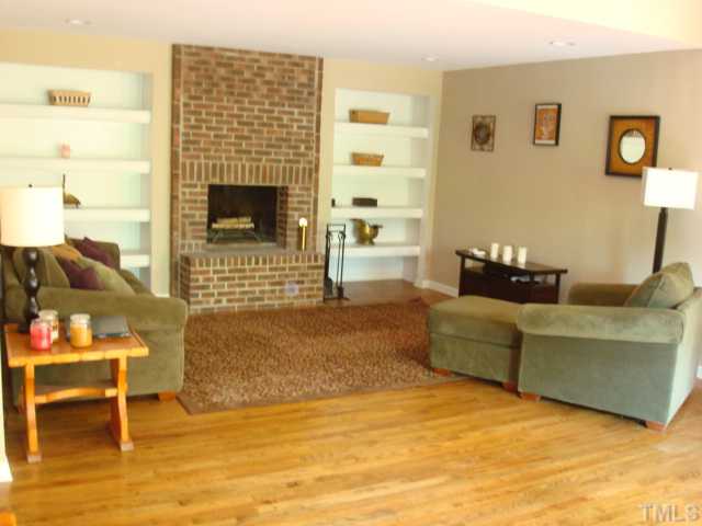 1600 Bennett Street Raleigh, NC 27604 - Photo 6 of 21 a living room with furniture and a fireplace