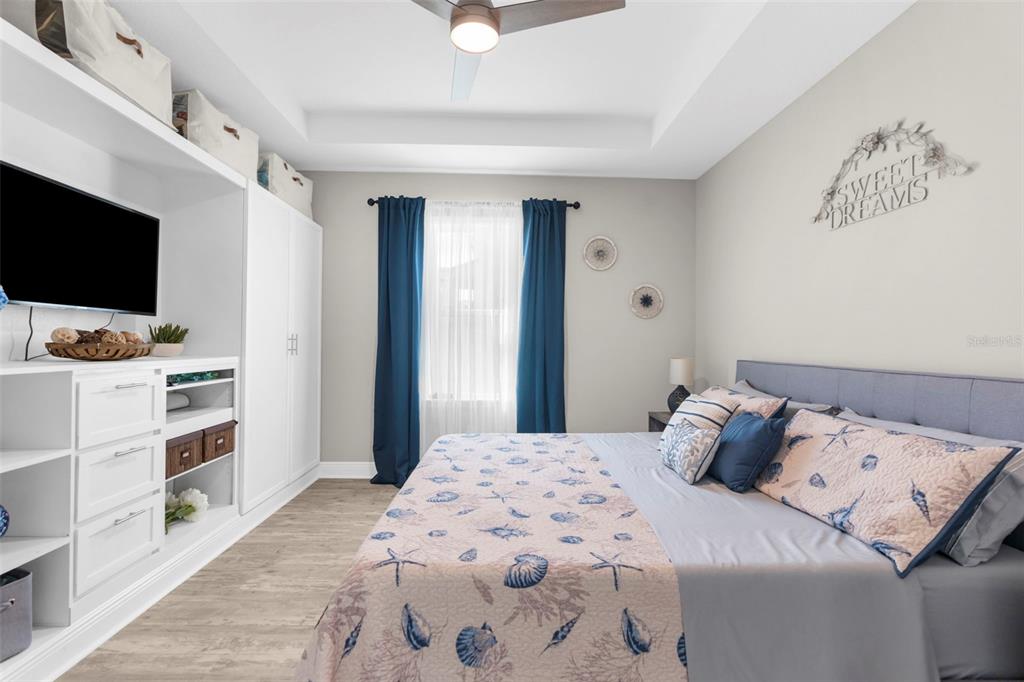 9347 North Star Court Weeki Wachee, FL 34613 - Photo 15 of 46 a bedroom with a bed and a flat screen tv