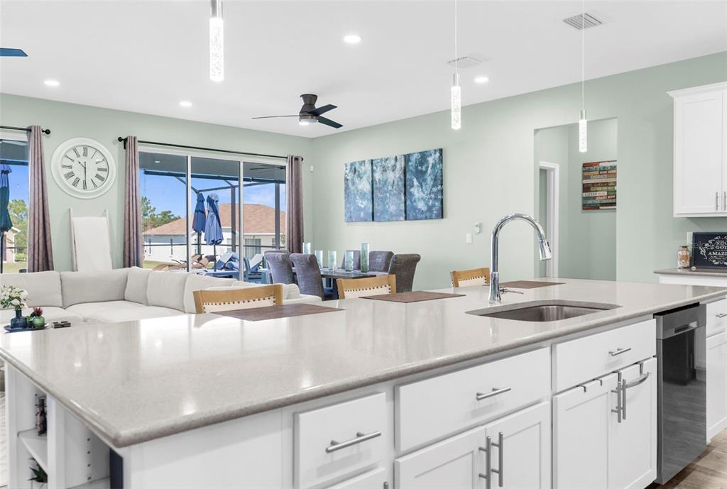 9347 North Star Court Weeki Wachee, FL 34613 - Photo 21 of 46 a view of a kitchen counter top space a sink stainless steel appliances and cabinets