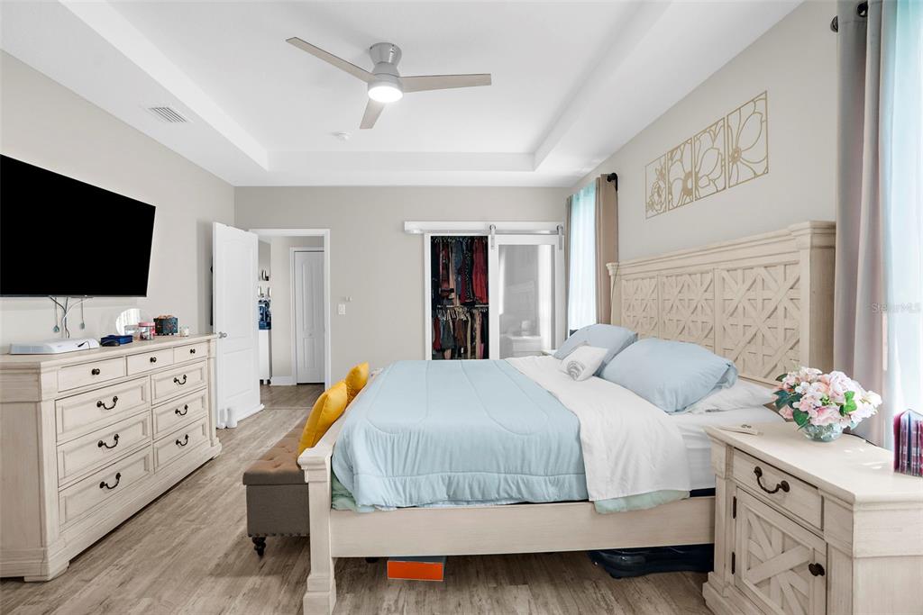 9347 North Star Court Weeki Wachee, FL 34613 - Photo 24 of 46 a bedroom with a bed and a flat screen tv