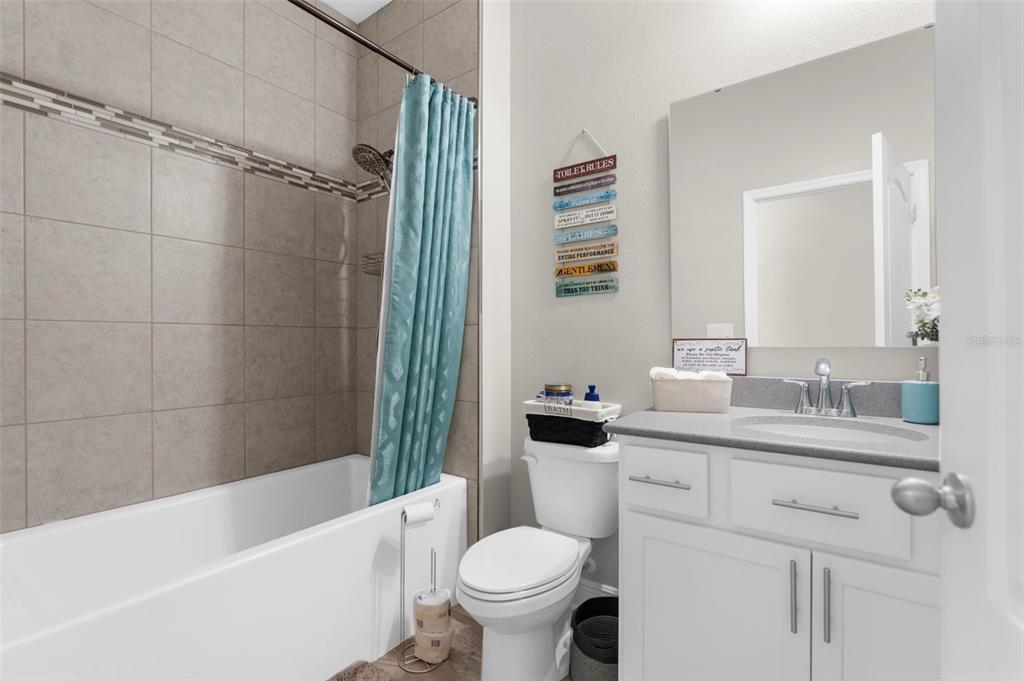 9347 North Star Court Weeki Wachee, FL 34613 - Photo 27 of 46 a bathroom with a sink toilet and shower