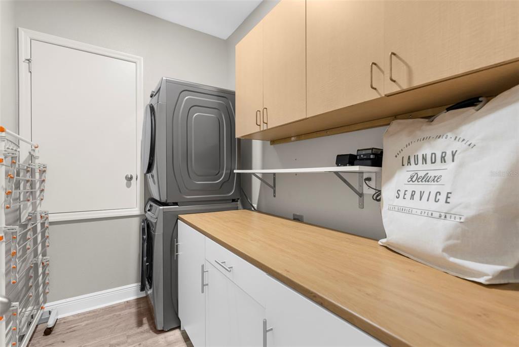 9347 North Star Court Weeki Wachee, FL 34613 - Photo 30 of 46 a utility room with dryer and washer