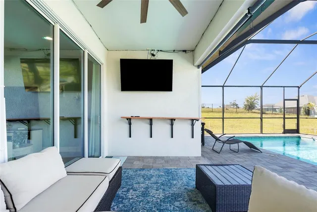 a view of a dining room with furniture window and outside view